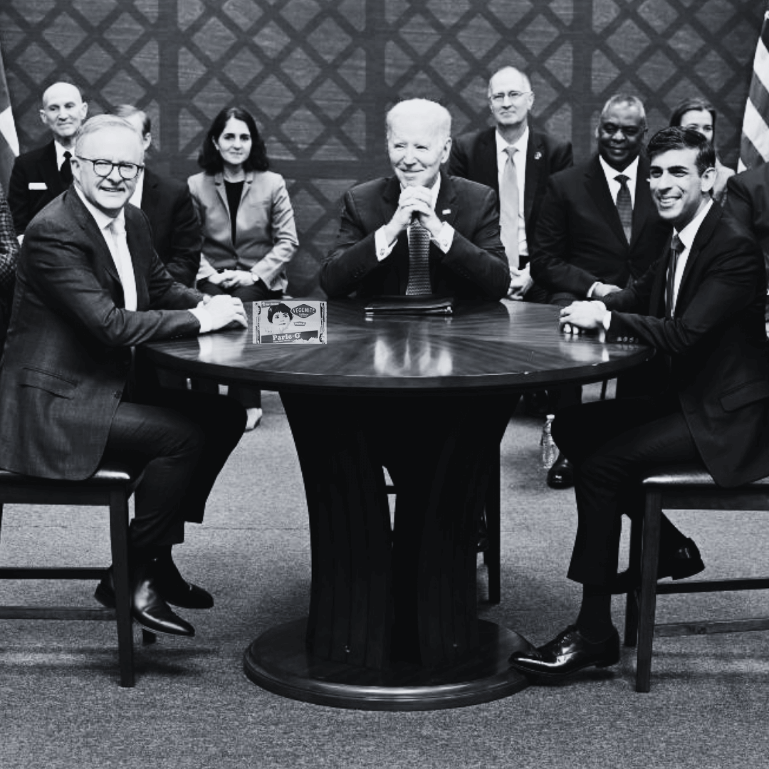 Prime Minister Anthony Albanese, US president Joe Biden and UK PM Rishi Sunak sitting at a table with a packet of Vegemite Parle-G biscuits.
