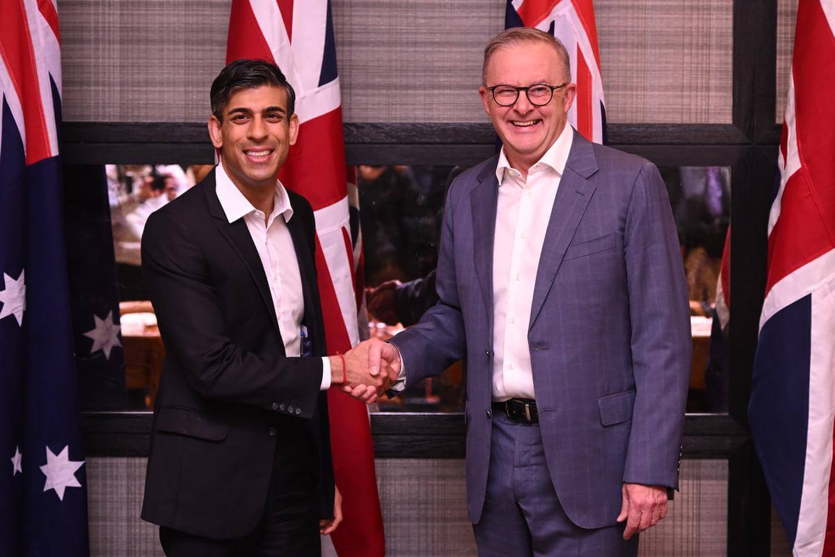 Prime Minister Anthony Albanese and UK PM Rishi Sunak shaking hands.